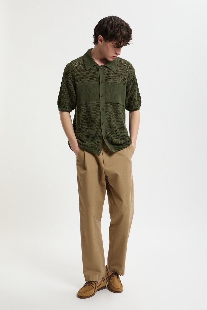 Maglia verde in maglia traforata