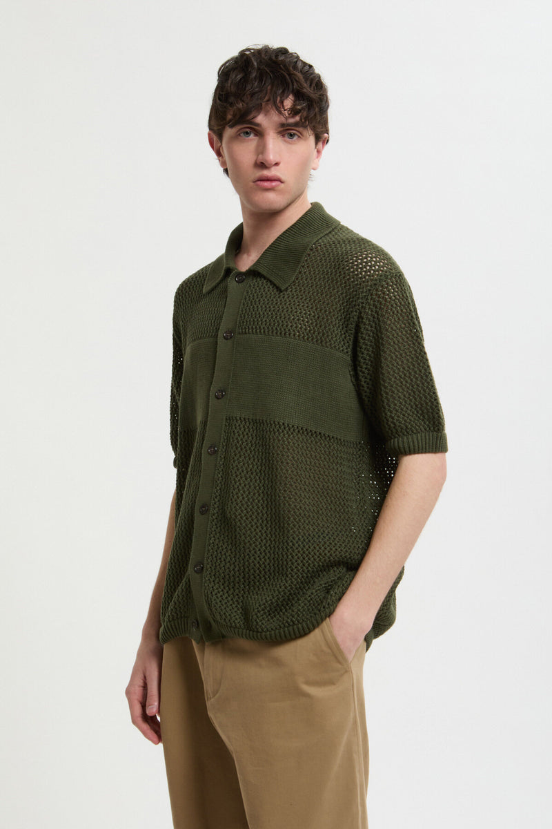 Maglia verde in maglia traforata